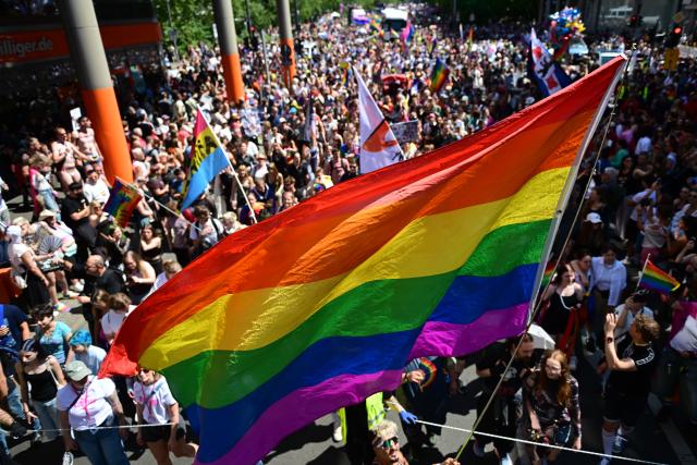 25 July 2026, Berlin: People demonstrate under the slogan "Attitude is Hot" during Christopher Street Day (CSD) in Berlin. For the first time, Berlin's CSD is taking place over two days. Photo: Fabian Sommer/dpa
