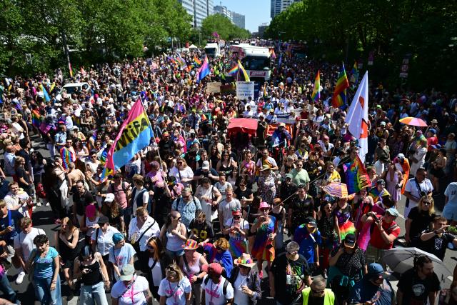 25 July 2026, Berlin: People demonstrate under the slogan "Attitude is Hot" during Christopher Street Day (CSD) in Berlin. For the first time, Berlin's CSD is taking place over two days. Photo: Fabian Sommer/dpa