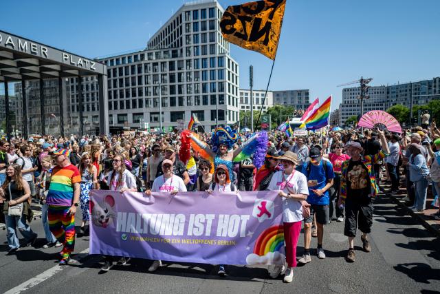 25 July 2026, Berlin: People take part in the Christopher Street Day (CSD) parade under the slogan "Attitude Is Hot." Photo: Fabian Sommer/dpa