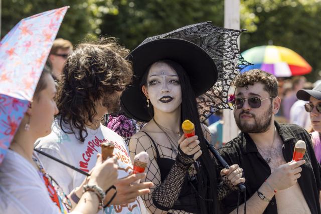 25 July 2026, Rhineland-Palatinate, Mainz: People take part in the Christopher Street Day (CSD) parade at the State Theater in front of Mainz Cathedral. The parade, which promotes diversity, tolerance, and queer rights, is traditionally organized by the Mainz-based association "Schwuguntia." Photo: Helmut Fricke/dpa