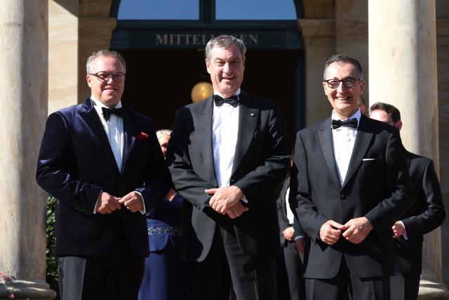 25 July 2026, Bavaria, Bayreuth: (L-R) Mario Voigt, Minister-President of Thuringia; Markus Soeder, Minister-President of Bavaria; and Cem Oezdemir, Minister-President of Baden-Wuerttemberg, arrive at the Festspielhaus for the opening of the Richard Wagner Festival. The Bayreuth Festival kicks off its 150th anniversary with Ludwig van Beethoven's Ninth Symphony. Photo: Karl-Josef Hildenbrand/dpa