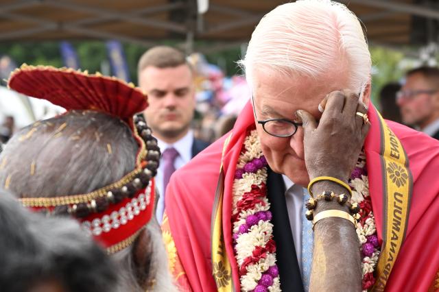 26 July 2026, North Rhine-Westphalia, Hamm: German President Frank-Walter Steinmeier (C) has a dot placed on his forehead at the Hindu community's grand temple festival in Germany. Photo: Federico Gambarini/dpa