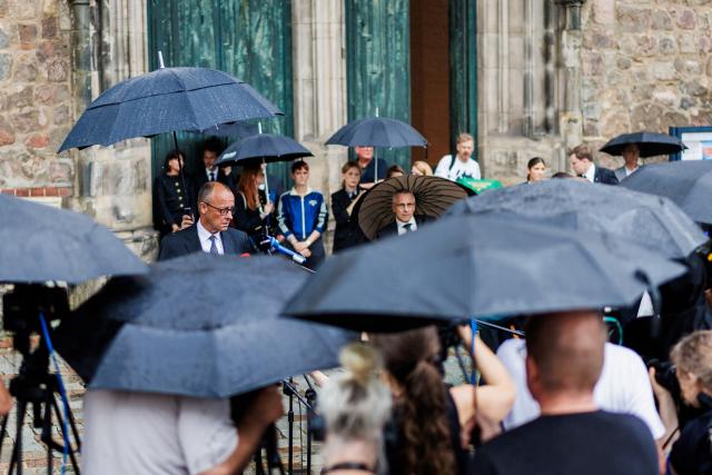 26 July 2026, Berlin: German Chancellor Friedrich Merz issues a statement to the press, at the scene where a vehicle had driven into a crowd of people on the sidelines of Christopher Street Day in Berlin. Photo: Christoph Soeder/dpa