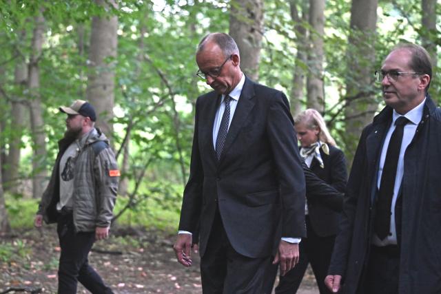 26 July 2026, Berlin: German Chancellor Friedrich Merz (C) and Minister of the Interior Alexander Dobrindt visit the site in Tiergarten where a car had plowed into a crowd on the sidelines of Christopher Street Day (CSD). Photo: Elisa Schu/dpa