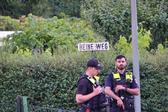 26 July 2026, Berlin: Police officers stand on the scene at an allotment garden community in Berlin-Spandau. According to information from security sources, one person was killed during a police operation in Spandau following the terrorist attack on the sidelines of Christopher Street Day (CSD). Photo: Michael Kappeler/dpa