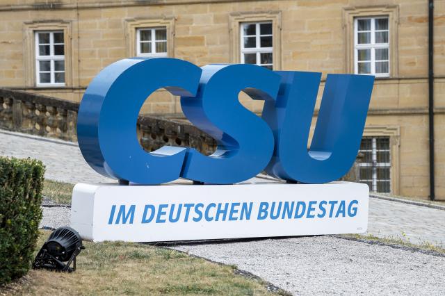 27 July 2026, Bavaria, Bad Staffelstein: The CSU logo in the courtyard of Banz Abbey, photographed at the start of the CSU state group's summer retreat in the Bundestag. Photo: Daniel Vogl/dpa