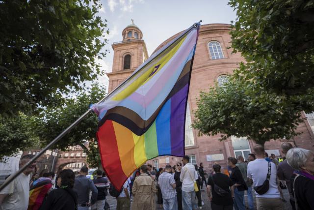 27 July 2026, Hesse, Frankfurt_Main: People gather in front of St. Paul's Church for a memorial rally, following the attack on the outskirts of the Christopher Street Day (CSD) in Berlin. Photo: Andreas Arnold/dpa