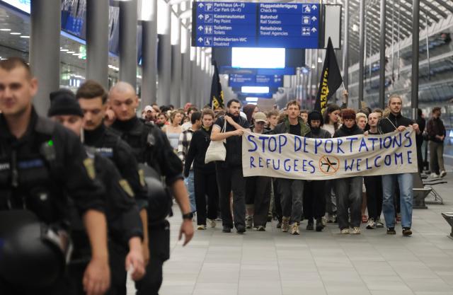 27 July 2026, Saxony, Schkeuditz: Participants in a left-wing demonstration gather inside a terminal at the Leipzig-Halle Airport. The activists organized the rally to protest an alleged deportation flight to Afghanistan. Photo: Sebastian Willnow/dpa