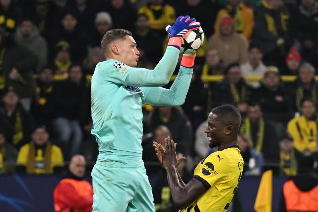 FILED - 05 November 2024, North Rhine-Westphalia, Dortmund: FILE PHOTO - Sturm Graz' goalkeeper Kjell Scherpen (L) intercepts the ball in front of Dortmund's Serhou Guirassy during the UEFA Champions League match between Borussia Dortmund and Sturm Graz, at Signal Iduna Park. Photo: Bernd Thissen/dpa
