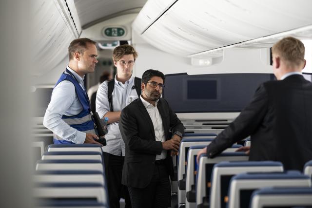 30 July 2026, Hesse, Frankfurt am Main: Hessen Minister of Economic Affairs, Energy, Transportation, Housing, and Rural Affairs Kaweh Mansoori speaks aboard a Boeing 787-9. Photo: Hannes P. Albert/dpa