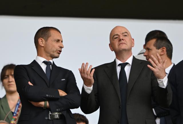 FILED - 29 June 2024, Berlin: FILE PHOTO - UEFA President Aleksander Ceferin (L) and FIFA President Gianni Infantino pictured in the stands ahead of the UEFA Euro 2024 round of 16 soccer match between Switzerland and Italy at Olympiastadion Berlin. Photo: Robert Michael/dpa