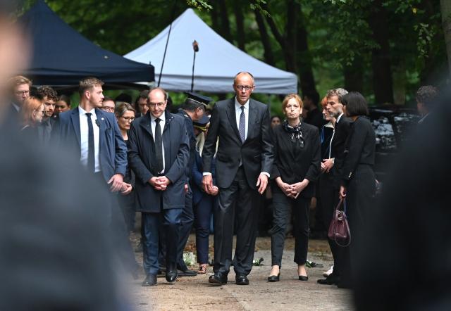 FILED - 26 July 2026, Berlin: German Chancellor Friedrich Merz (C) and Minister of the Interior Alexander Dobrindt visit the site in Tiergarten where a car had plowed into a crowd on the sidelines of Christopher Street Day (CSD). Photo: Elisa Schu/dpa