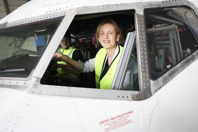 31 July 2026, Hamburg: German Federal Minister of Education Karin Prien (CDU) sits inside the cockpit of a decommissioned Boeing 737 aircraft inside a maintenance hangar at Lufthansa Technik AG. Photo: Christian Charisius/dpa