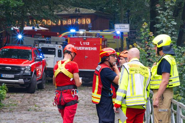 31 July 2026, Saxony, Rathen: Emergency responders stand on the scene near the Rathen Rock Theater, where a man has died in a storm in Saxony after killing by a fallen tree. Photo: Jonas Schubert/xcitepress/dpa