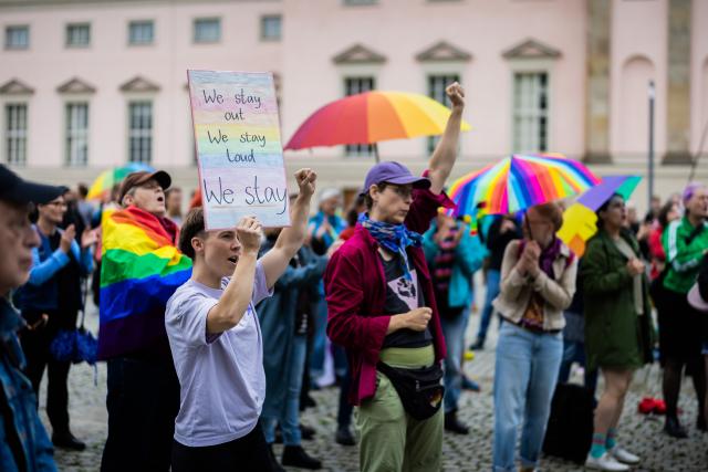 01 August 2026, Berlin: People gather for a rally under the slogan "We Won't Let Ourselves Be Divided" in solidarity with the queer community following the attack that took place on the outskirts of Christopher Street Day last week at Bebelplatz. Photo: Christoph Soeder/dpa
