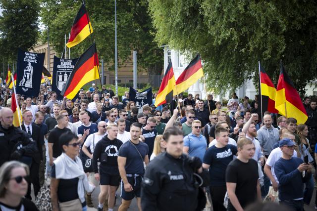 01 August 2026, Mecklenburg-Western Pomerania, Schwerin: Demonstrators from the Alternative for Germany (AfD) youth organization Generation Deutschland march through downtown Schwerin during a protest to mark "German Youth Day". Photo: Philip Dulian/dpa