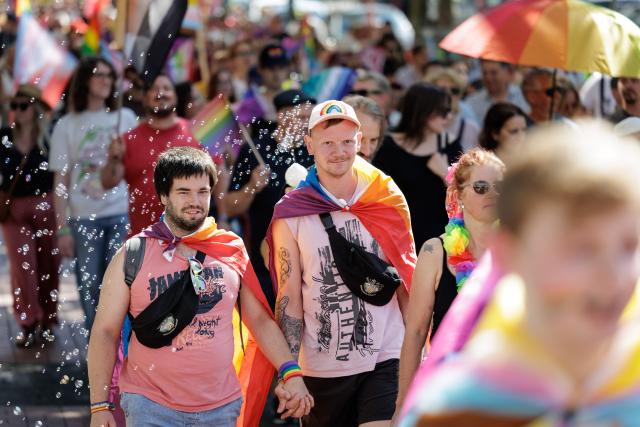 01 August 2026, North Rhine-Westphalia, Moers: Participants in the Christopher Street Day (CSD) Pride Parade march through downtown. Photo: David Ebener/dpa