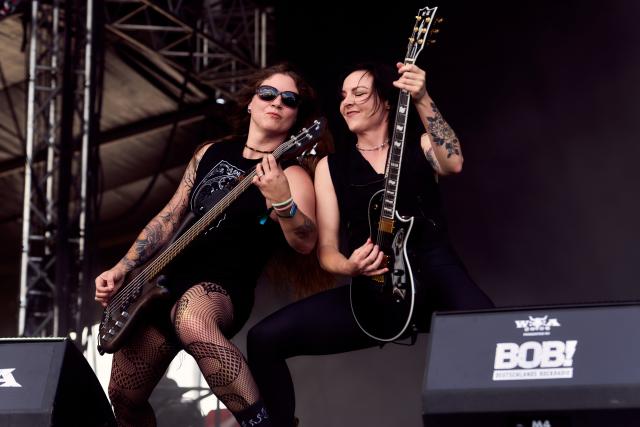 01 August 2026, Schleswig-Holstein, Wacken: Ivana "Ivy" Jenkins (L) and Tara McLeod of the Canadian band Kittie perform on stage at the Wacken Open Air (W:O:A). Photo: Marcus Golejewski/dpa