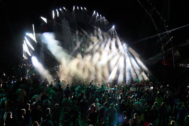 02 August 2026, Rhineland-Palatinate, Kastellaun: Ravers dance in front of an open-air dance floor at the 'Nature One' techno festival. The former Pydna missile base is the venue for one of Germany's largest electronic music festivals. Photo: Thomas Frey/dpa