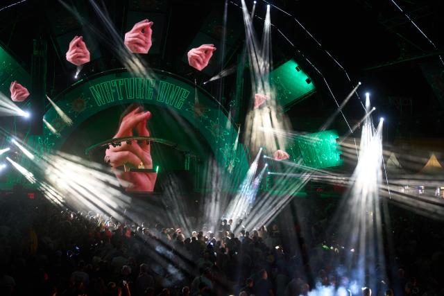 02 August 2026, Rhineland-Palatinate, Kastellaun: Ravers dance in front of an open-air dance floor at the 'Nature One' techno festival. The former Pydna missile base is the venue for one of Germany's largest electronic music festivals. Photo: Thomas Frey/dpa
