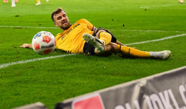 FILED - 07 November 2025, Saxony, Dresden: FILE PHOTO - Dynamo Dresden's Lars Buenning slides after a ball during the 2nd German Bundesliga soccer match between SG Dynamo Dresden and 1. FC Nuernberg at Rudolf-Harbig-Stadion. Photo: Robert Michael/dpa - IMPORTANT NOTE: In accordance with the regulations of the DFL German Football League and the DFB German Football Association, it is prohibited to utilize or have utilized photographs taken in the stadium and/or of the match in the form of sequential images and/or video-like photo series.