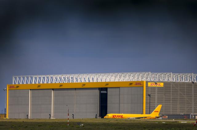 FILED - 04 June 2025, Schkeuditz: FILE PHOTO - A DHL cargo plane is parked on the apron at the DHL hub at Leipzig-Halle Airport. Photo: Jan Woitas/dpa