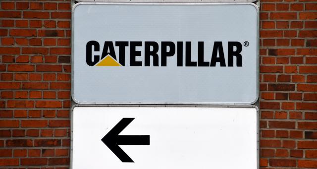 FILED - 09 May 2014, Schleswig-Holstein, Kiel: FILE PHOTO - A Caterpillar company sign is displayed on a building at the earthmoving equipment manufacturer's site in Kiel-Friedrichsort. Photo: picture alliance / dpa