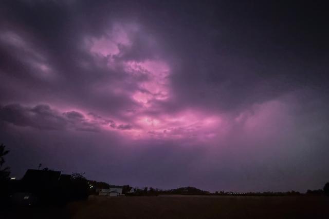 04 August 2026, Bavaria, Dillingen an der Donau: A storm front with lightning moves across Dillingen an der Donau. Photo: Jason Tschepljakow/dpa