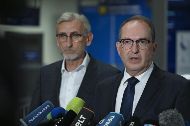 05 August 2026, Saxony, Schkeuditz: Alexander Dobrindt, German Minister of the Interior, speaks at a press conference in a terminal at Leipzig/Halle Airport, following a night-time drone incident. German Police specialists defused an explosive device. Photo: Hendrik Schmidt/dpa