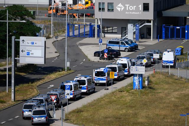 06 August 2026, Saxony, Schkeuditz: Police are on the scene at Leipzig/Halle Airport. An investigation is underway following the drone incident that occurred early Wednesday morning. According to security sources, the drone-which was equipped for an attack-was seized near a Ukrainian transport aircraft. Security authorities are on high alert. Photo: Hendrik Schmidt/dpa