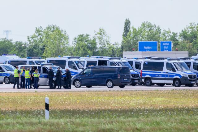 06 August 2026, Saxony, Schkeuditz: Police officers are on the scene at the end of the north runway at Leipzig/Halle Airport. Investigations are underway following the drone incident that occurred early Wednesday morning. According to security sources, the drone-which was equipped for an attack-was seized near a Ukrainian transport aircraft. Security authorities are on high alert. Photo: Hendrik Schmidt/dpa
