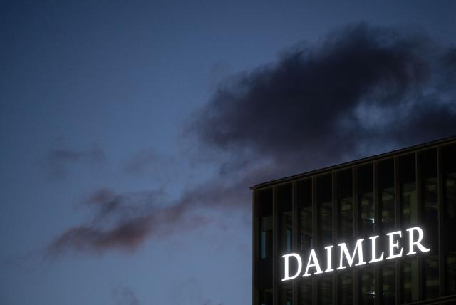 FILED - 04 February 2021, Baden-Wuerttemberg, Stuttgart: FILE PHOTO - The Daimler logo can be seen on a facade of the company's headquarters in Stuttgart. Photo: Marijan Murat/dpa