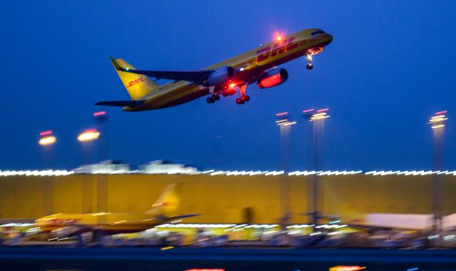 07 August 2026, Saxony, Schkeuditz: A DHL aircraft takes off from Leipzig/Halle Airport. Investigations are underway following a drone incident early on Wednesday. According to security sources, a drone carrying an explosive device was seized near a Ukrainian transport aircraft. Security authorities are on high alert. Photo: Hendrik Schmidt/dpa