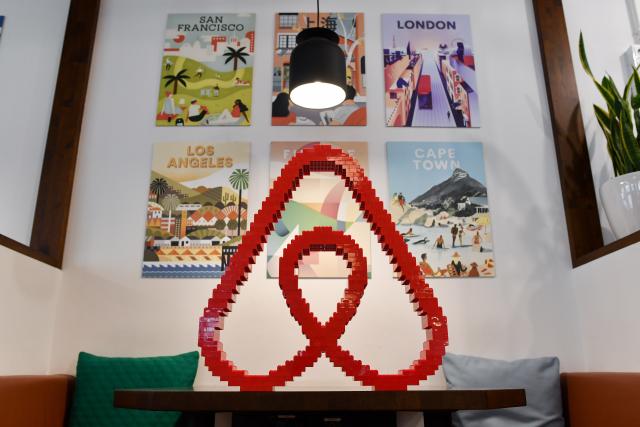 FILED - 16 April 2018, Berlin: FILE PHOTO - A general view of the Airbnb logo at the office of Airbnb Germany GmbH on Neue Schoenhauser street. Photo: Jens Kalaene/dpa-Zentralbild/dpa