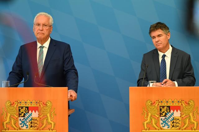07 August 2026, Bavaria, Munich: German Interior Minister Joachim Herrmann (L) and Manfred Hauser (R), president of the Bavarian State Office for the Protection of the Constitution, attend a press conference to present the agency's report for the first half of 2026 at the Bavarian State Ministry of the Interior. Photo: Florian Diettrich/dpa