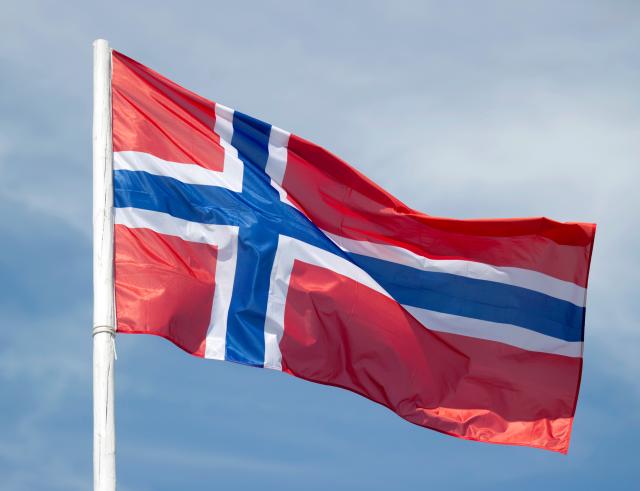 FILED - 26 May 2011, Brandenburg, Klettwitz: FILE PHOTO - The national flag of Norway flutters in Brandenburg. Photo: Patrick Pleul/dpa-Zentralbild/dpa