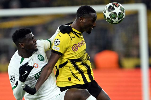 FILED - 19 February 2025, North Rhine-Westphalia, Dortmund: File Photo - Dortmund's Sehrou Guirassy (R) and Sporting's Ousmane Diomande battle for the ball during the UEFA Champions League layoff second leg soccer match between Borussia Dortmund and Sporting Lisbon at the Signal Iduna Park. Photo: Federico Gambarini/dpa