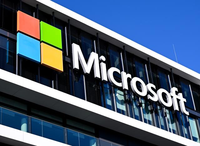 FILED - 30 January 2026, Bavaria, Munich: FILE PHOTO - The Microsoft logo can be seen on the Microsoft Germany headquarters building in Munich. Photo: Sven Hoppe/dpa