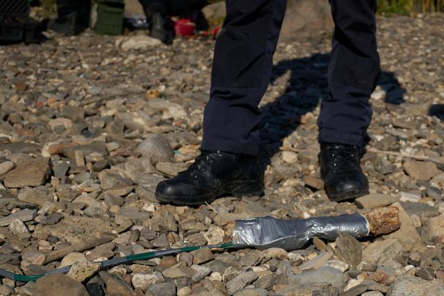 11 August 2026, Rhineland-Palatinate, Koblenz: A World War II bazooka rocket is detonated in a controlled explosion on the Rhine. The rocket is placed inside a sandbag before being safely detonated. Photo: Sascha Ditscher/dpa
