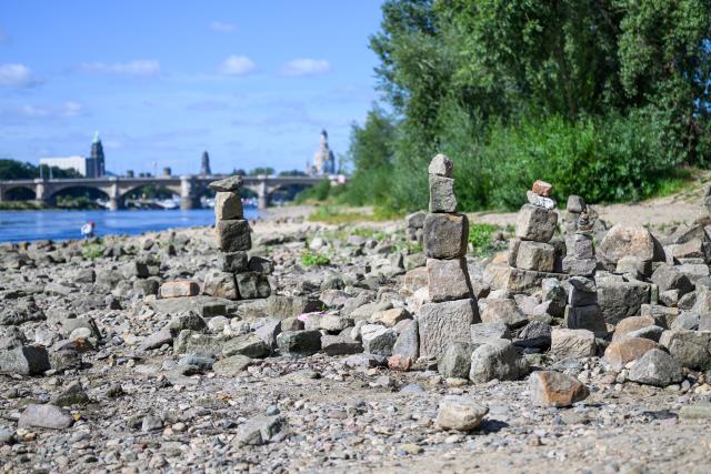 11 August 2026, Saxony, Dresden: The riverbed of the Priessnitz at its confluence with the Elbe has dried up. Photo: Robert Michael/dpa