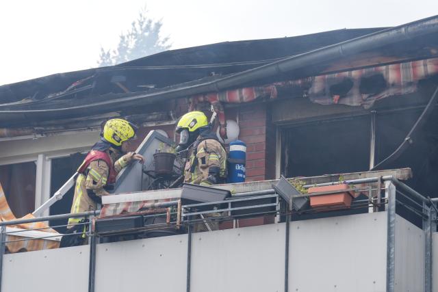 11 August 2026, Berlin: Firefighters inspect a nursing home in Berlin's Biesdorf district, where a fire broke out this morning. The residents were brought to safety, according to a fire department spokesperson. Photo: Soeren Stache/dpa