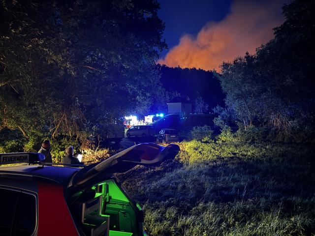11 August 2026, Saxony, Plauen: A fire sends thick smoke into the air from a wooded area near Plauen. Photo: Stephan Fricke/NEWS5/dpa