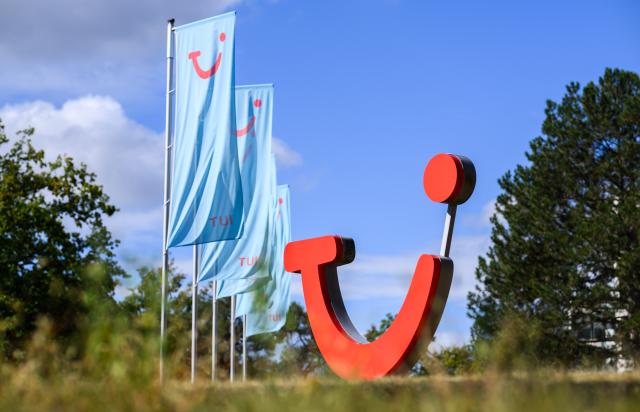 FILED - 02 September 2025, Lower Saxony, Hanover: FILE PHOTO - A logo stands in front of the headquarters of the TUI Group tourism company. Photo: Julian Stratenschulte/dpa