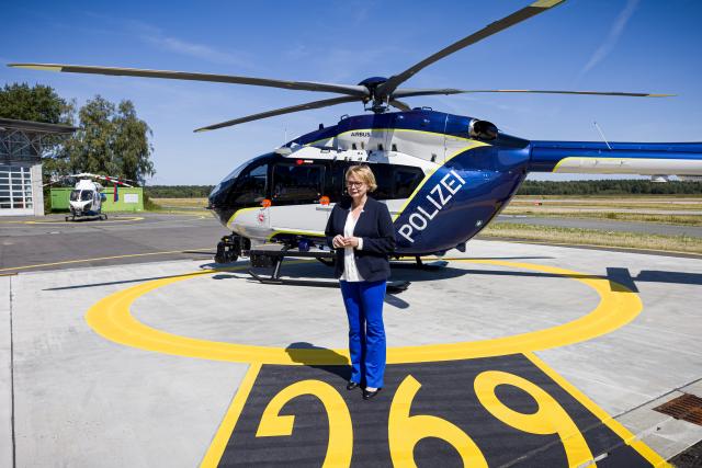 12 August 2026, Lower Saxony, Langenhagen: Lower Saxony's Minister of the Interior Daniela Behrens stands in front of the police's new Airbus Helicopters H145 helicopter. Photo: Moritz Frankenberg/dpa