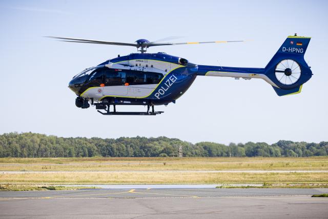 12 August 2026, Lower Saxony, Langenhagen: A new Airbus Helicopters H145 police helicopter lands on the grounds of Hannover-Langenhagen Airport. Photo: Moritz Frankenberg/dpa