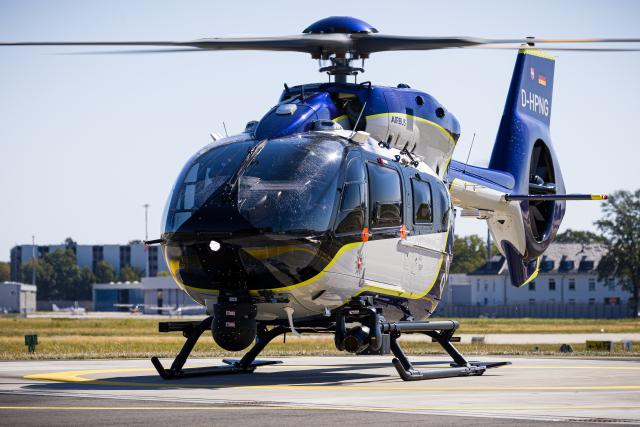 12 August 2026, Lower Saxony, Langenhagen: A new Airbus Helicopters H145 police helicopter is parked on the grounds of Hannover-Langenhagen Airport. Photo: Moritz Frankenberg/dpa