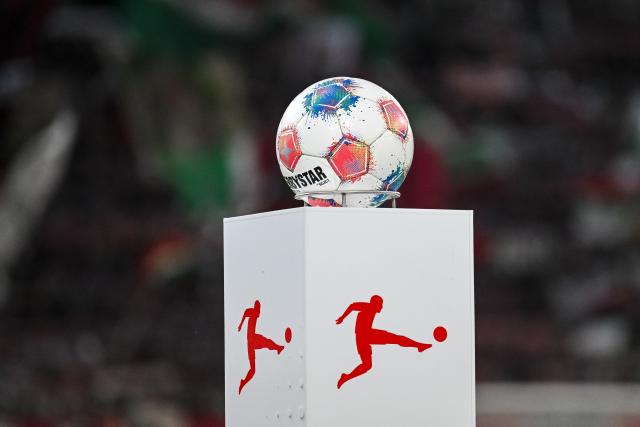 FILED - 27 February 2026, Bavaria, Augsburg: FILE PHOTO - The match ball is on a pedestal with the DFL logo before the German Bundesliga soccer match between FC Augsburg and 1. FC Cologne at the WWK-Arena. Photo: Harry Langer/dpa - IMPORTANT NOTE: In accordance with the regulations of the DFL German Football League and the DFB German Football Association, it is prohibited to utilize or have utilized photographs taken in the stadium and/or of the match in the form of sequential images and/or video-like photo series.