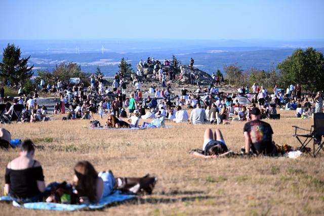 12 August 2026, Hesse, Feldberg: People watch the solar eclipse on the Feldberg. Photo: JEB/dpa