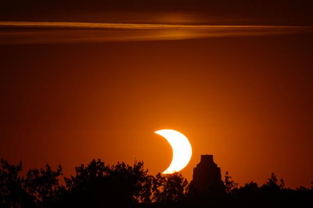 12 August 2026, Saxony, Leipzig: The spire of the Monument to the Battle of the Nations rises above the horizon ahead of the partial solar eclipse. Photo: Hendrik Schmidt/dpa