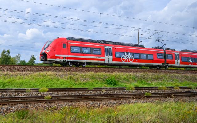 FILED - 17 September 2025, Brandenburg, Senftenberg: FILE PHOTO - A Deutsche Bahn regional express train travels through southern Brandenburg. Photo: Patrick Pleul/dpa